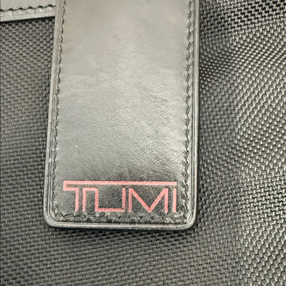 Tumi Black Messenger Bag with Silver Accents. Excellent condition